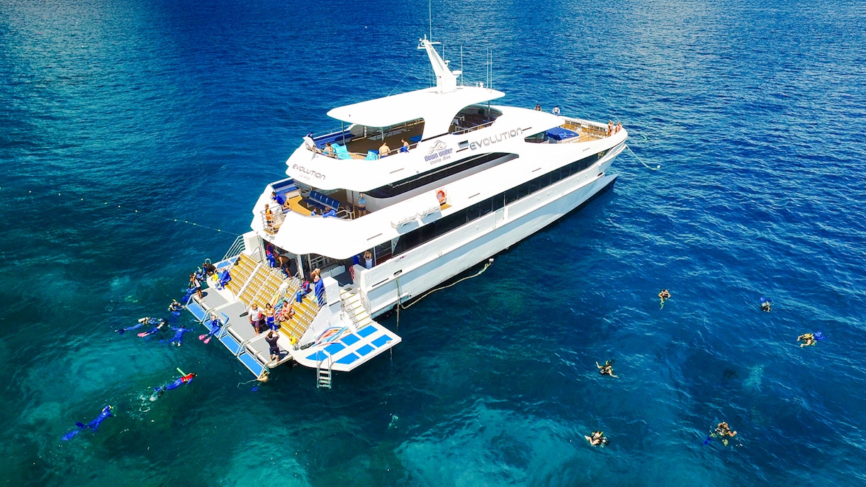Cruise ship with snorkelers near Great Barrier Reef, Australia.
