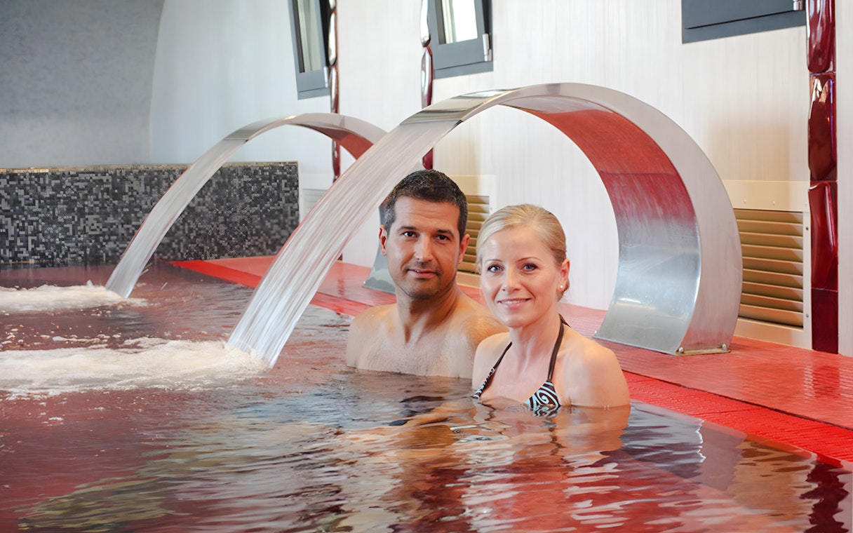 Couple relaxing in the pool at Rudas Thermal Spa, Budapest.