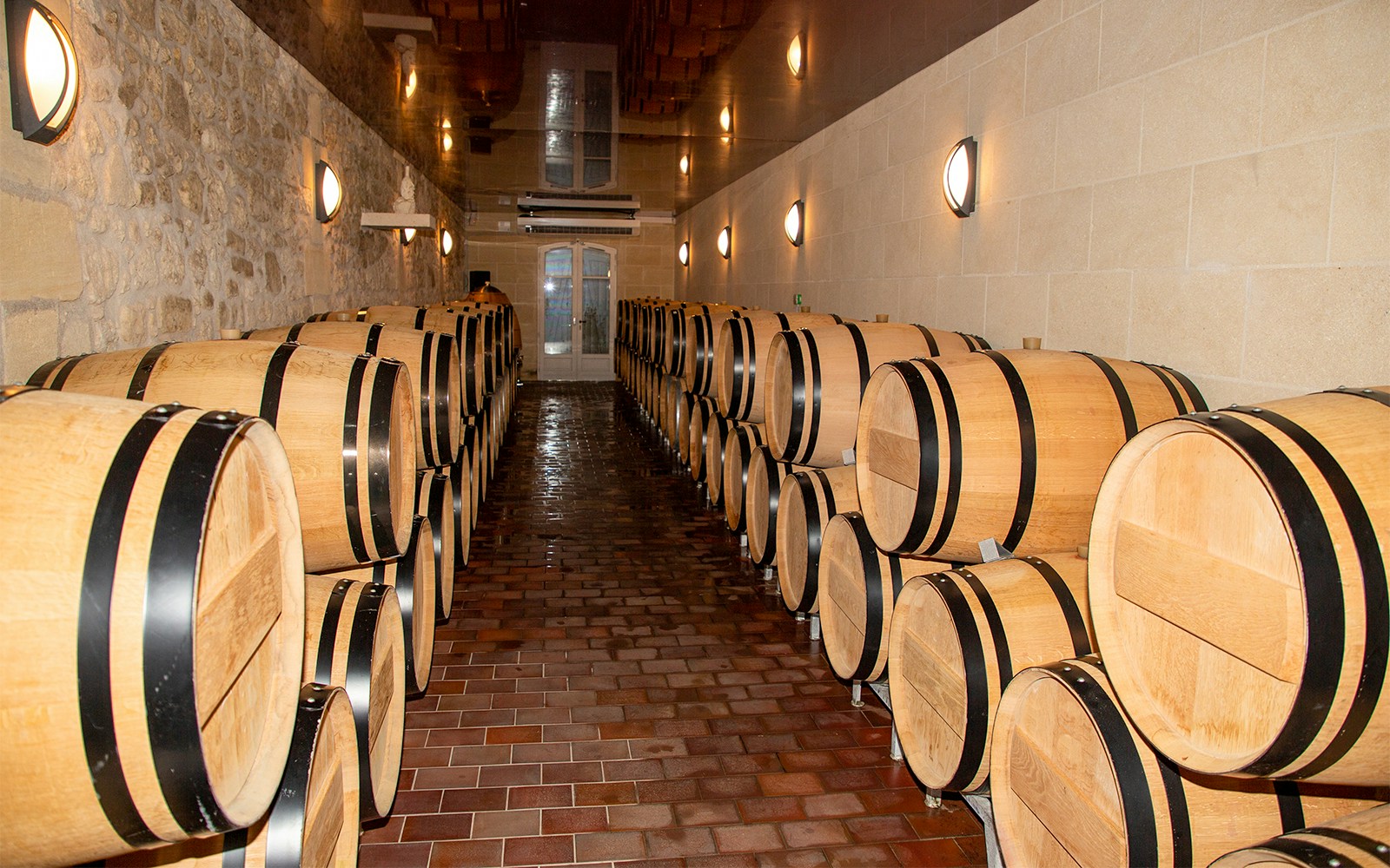 Wine barrels in a cellar during a Saint Emilion winery tour.