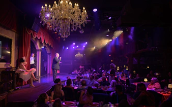 Interactive 1920s-themed dinner show with audience and performers on stage in Orlando.