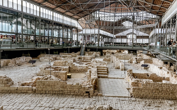 Tourists viewing ancient ruins at El Born Cultural Center in Barcelona.