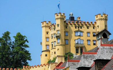 Hohenschwangau Castle exterior with yellow towers in Bavaria.