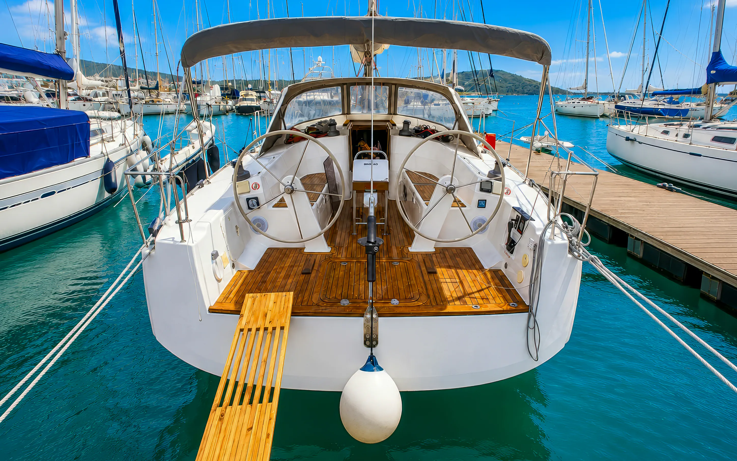 Sailboat docked in Pula marina, ready for snorkeling and cliff jumping adventure.