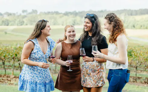 Group enjoying wine at a vineyard on Hunter Valley tour from Newcastle.