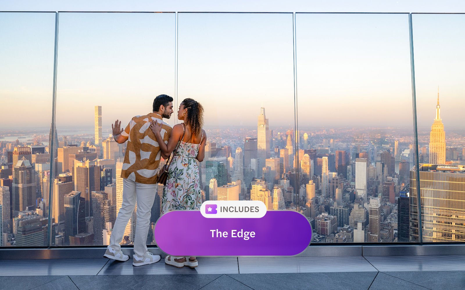 Couple enjoying New York City skyline view from Edge at Hudson Yards.