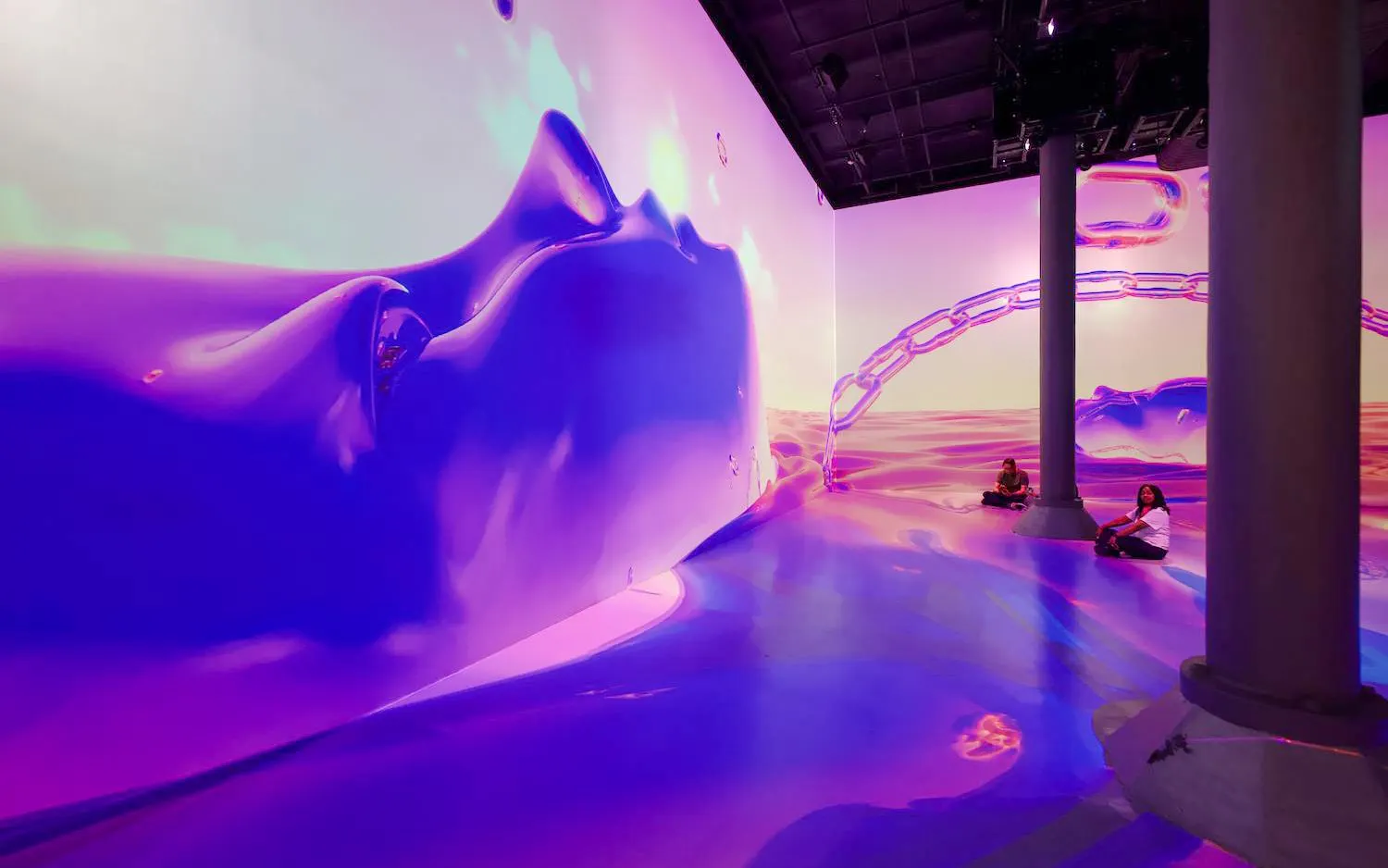 Guests exploring immersive digital art installation at ARTECHOUSE DC.