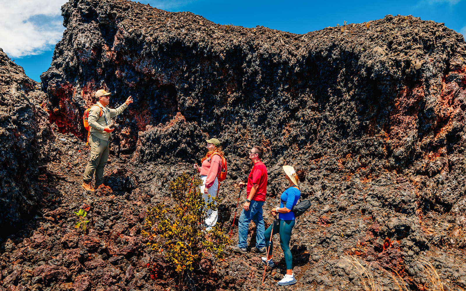 Guests exploring volcanic terrain on Hawaii adventure tour.