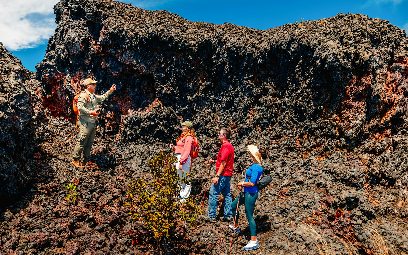 Guests exploring volcanic terrain on Hawaii adventure tour.