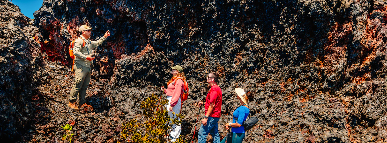 Guests exploring volcanic terrain on Hawaii adventure tour.