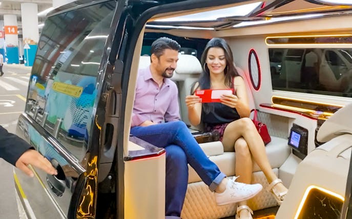 Private transfer at Sabiha Gokcen Airport, Istanbul, with passengers in luxury van.