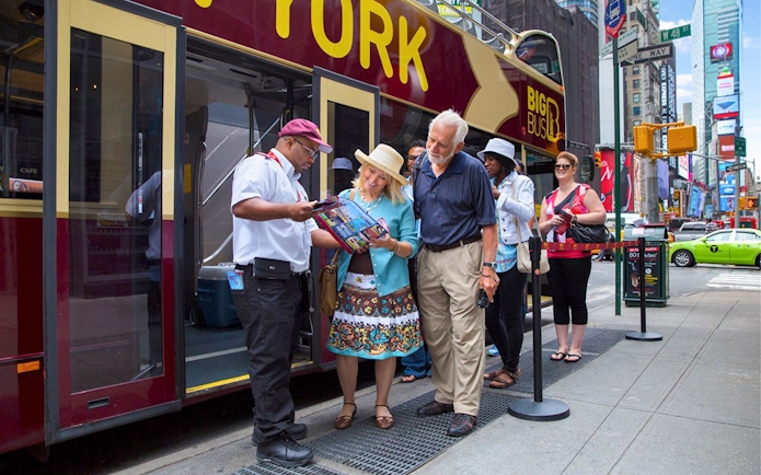 Tourists boarding Big Bus HOHO Tour at Times Square, New York.