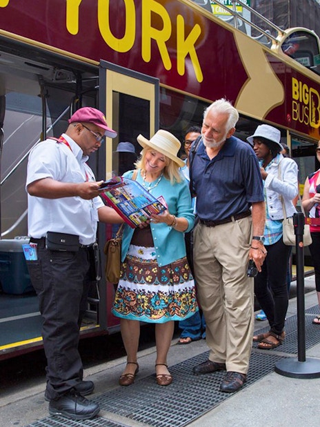 Tourists boarding Big Bus HOHO Tour at Times Square, New York.