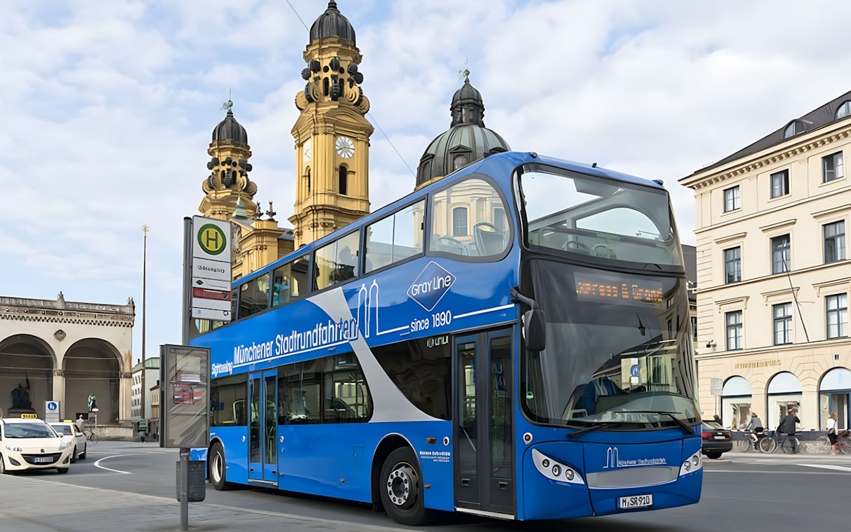 Double-decker tour bus near Theatinerkirche in Munich city center.
