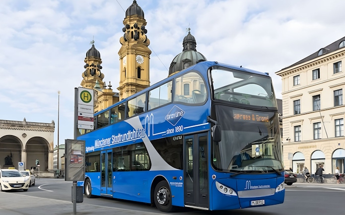 Double-decker tour bus near Theatinerkirche in Munich city center.
