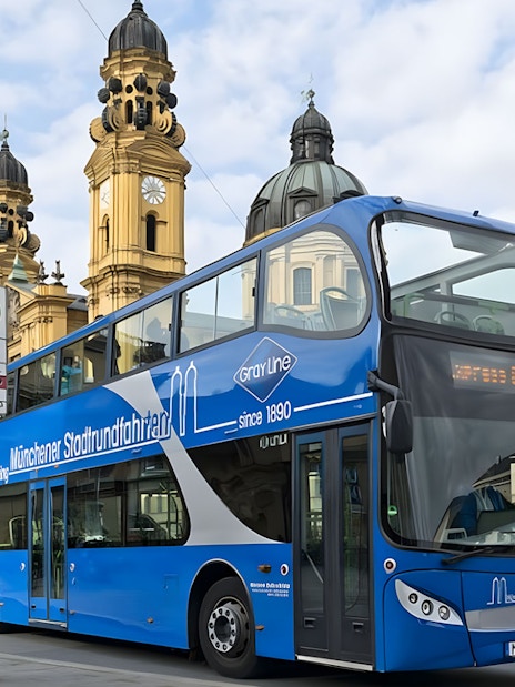 Double-decker tour bus near Theatinerkirche in Munich city center.
