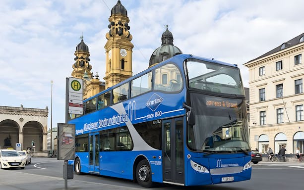 Double-decker tour bus near Theatinerkirche in Munich city center.