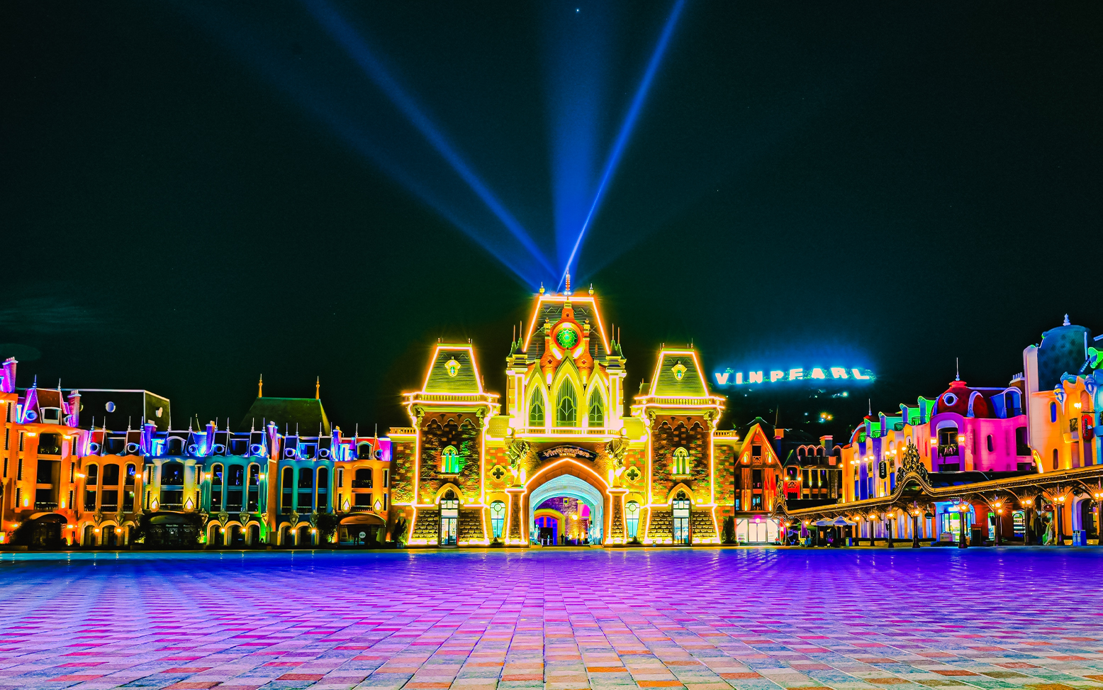 VinPearl Harbour entrance illuminated at night with colorful lights.
