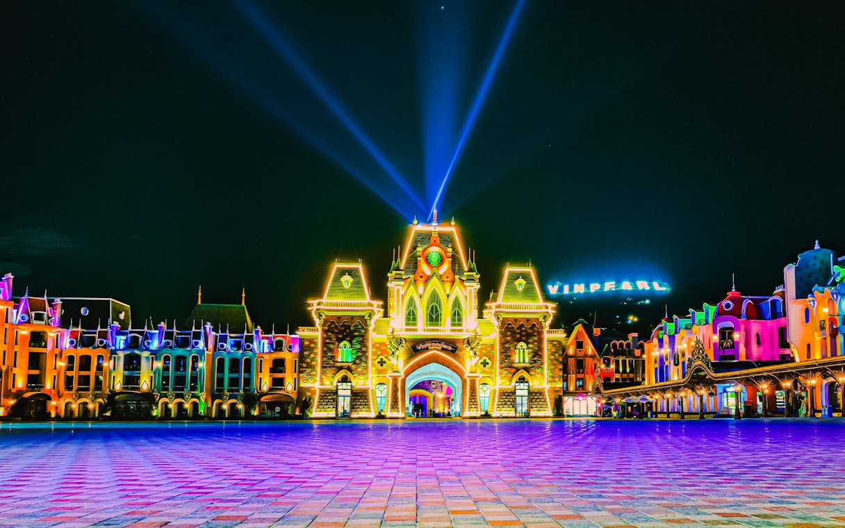 VinPearl Harbour entrance illuminated at night with colorful lights.