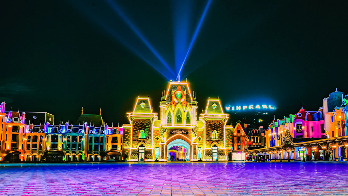 VinPearl Harbour entrance illuminated at night with colorful lights.