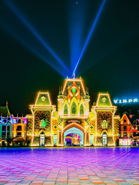 VinPearl Harbour entrance illuminated at night with colorful lights.