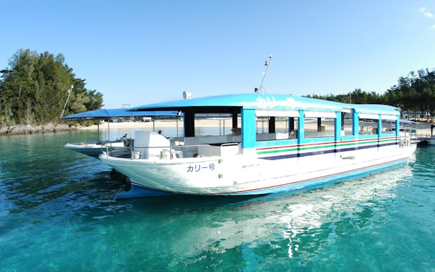 Glass-bottom boat on Okinawa Hip Hop Bus Tour near Churaumi Aquarium.