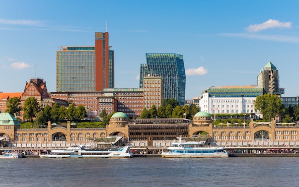 Hamburg harbor with boats and historic buildings on a 2-hour boat tour.