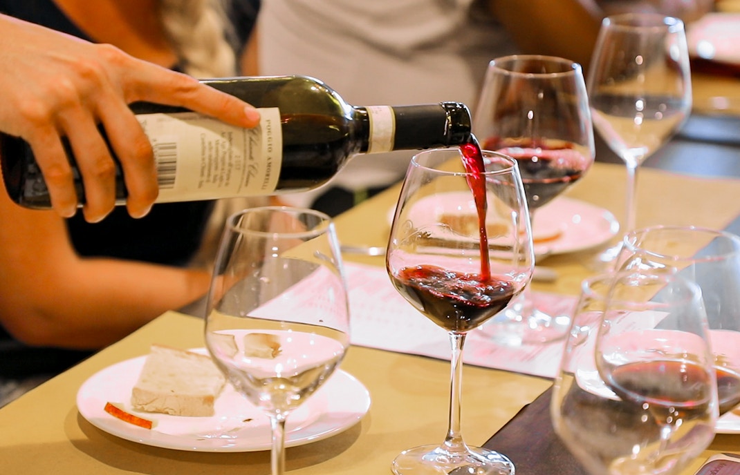 People enjoying wine at The Merchant's Hotel Great Room for lunch.