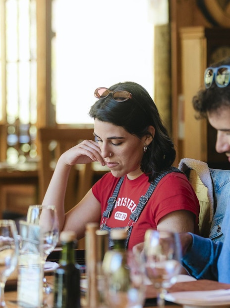 Tourists reviewing menu at Santuario del Río spa and lodge dining area.