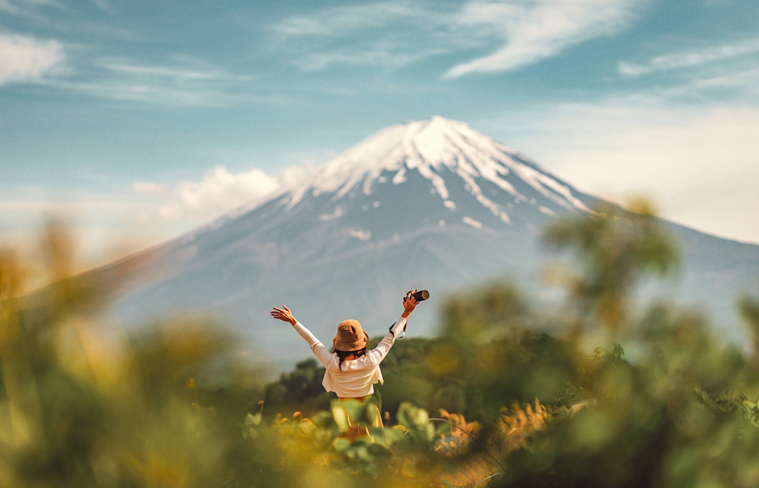 A tourist in front of Mt. Fuji