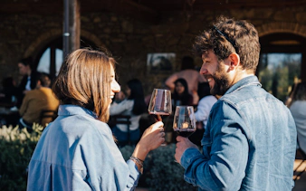 Couple enjoying wine tasting on Chianti Half Day Tour from Florence.