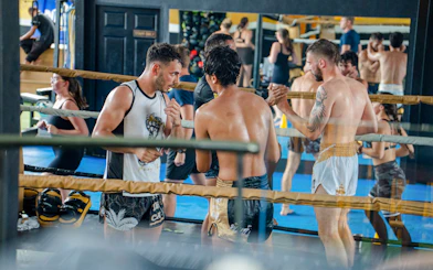 Muay Thai beginners practicing in a Koh Samui boxing gym.