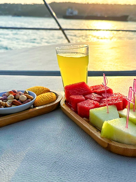 Snacks and drinks on a yacht deck during Bosphorus sunset cruise, Istanbul.