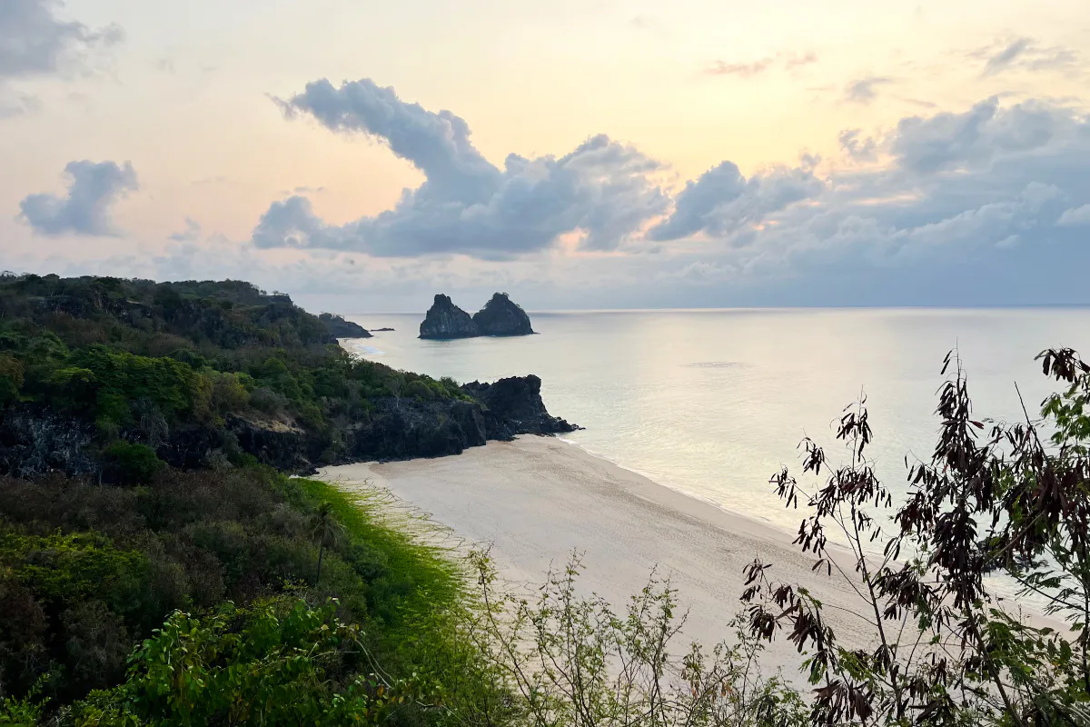 Sancho Beach view with Dois Irmãos rocks at sunset, Fernando de Noronha, Brazil.