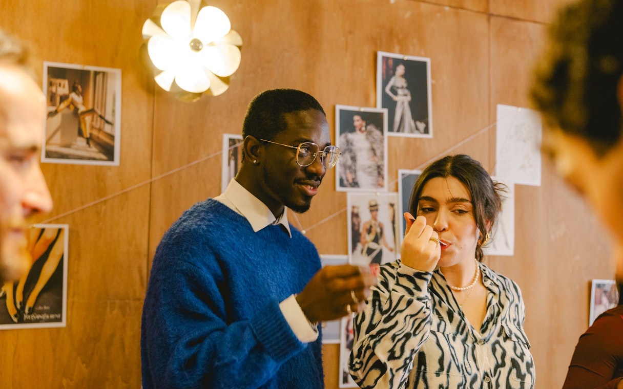 Couple tasting cheese during Emily in Paris tour, Paris, France.