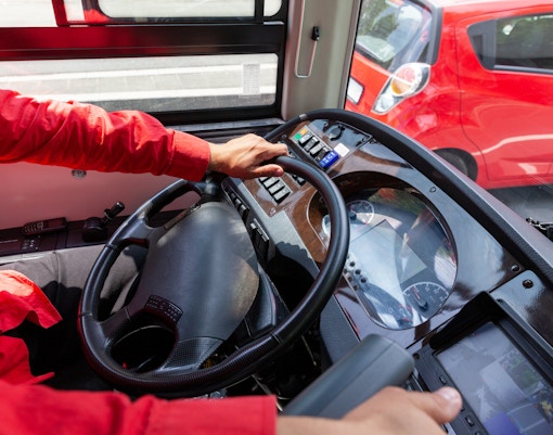 A group of people enjoying the upper deck of the HOHO Bus in New Orleans.