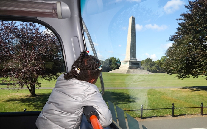 Child looking at the Wellington Monument from a bus on a Dublin Big Bus Tour.