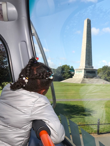 Child looking at the Wellington Monument from a bus on a Dublin Big Bus Tour.