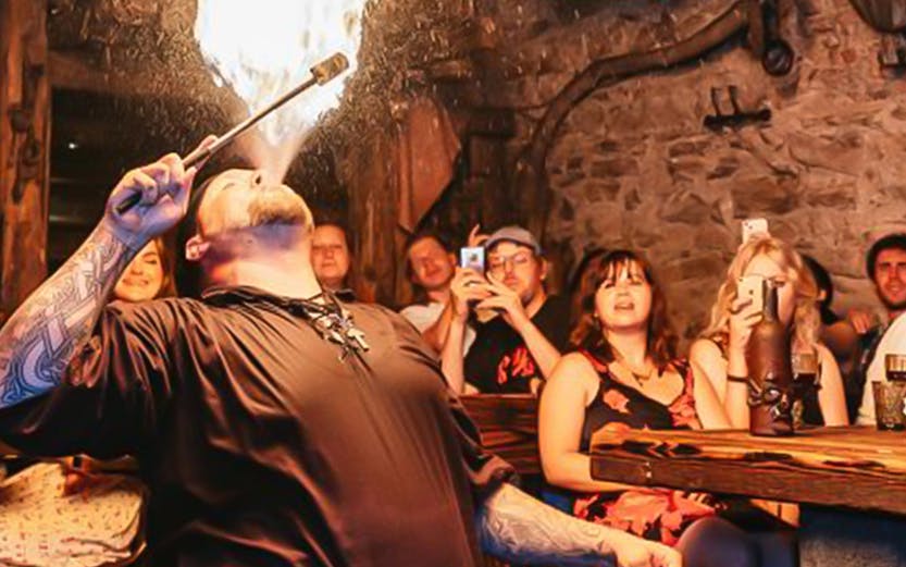 Fire performer entertaining guests at a Medieval Dinner in Prague.