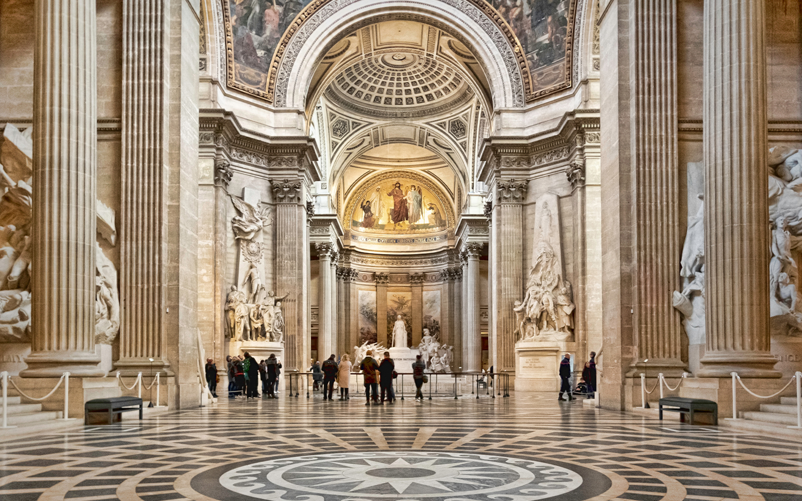 Pantheon Paris interior with Corinthian columns and ornate dome ceiling.