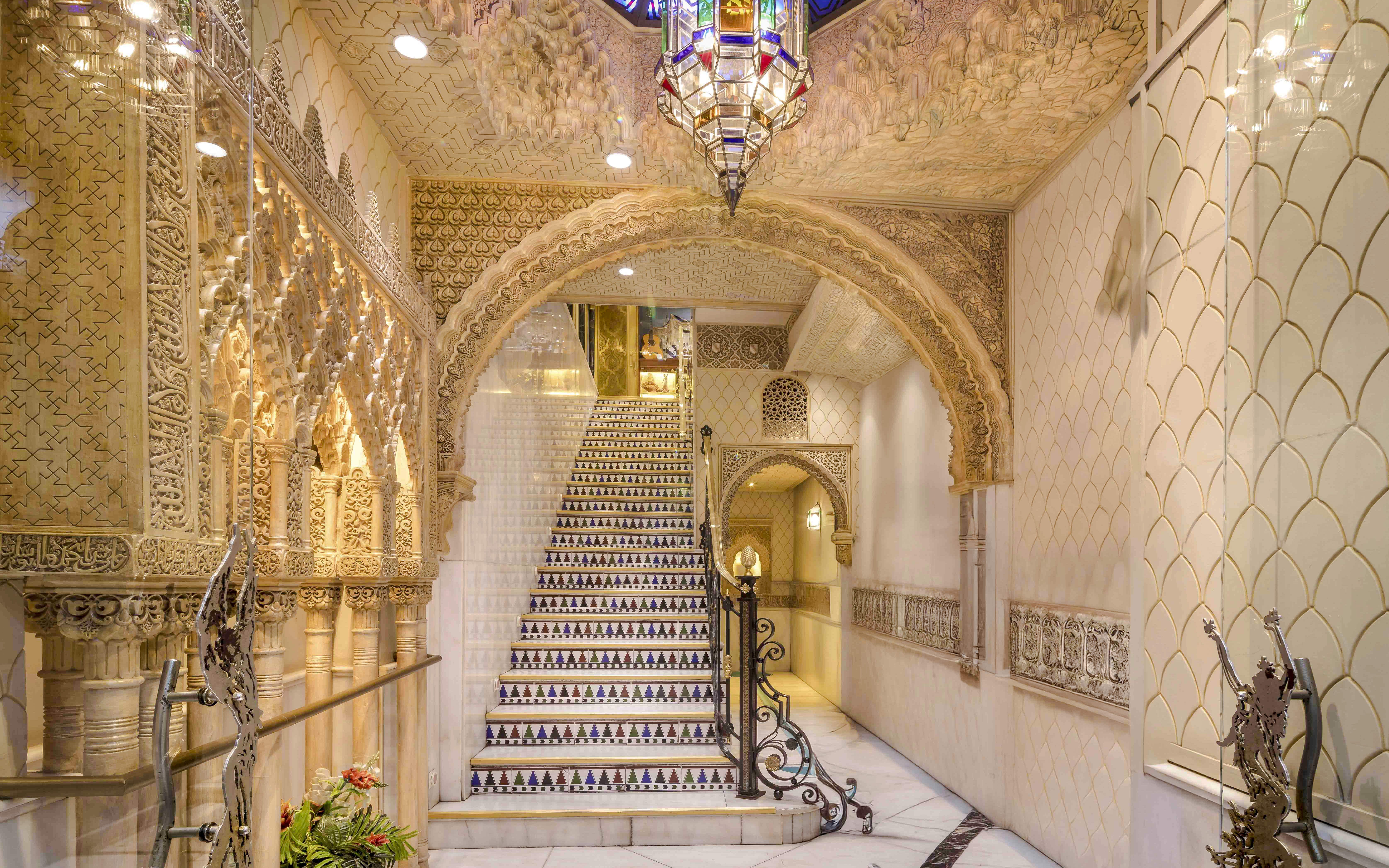 Tablao Cordobes interior with ornate arches and decorative staircase in Barcelona.