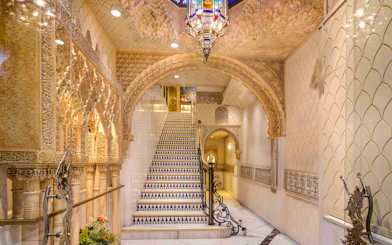 Tablao Cordobes interior with ornate arches and decorative staircase in Barcelona.
