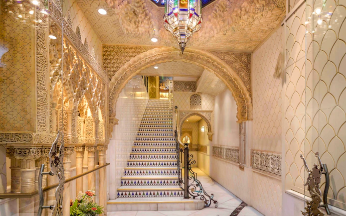 Tablao Cordobes interior with ornate arches and decorative staircase in Barcelona.