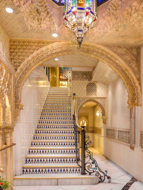 Tablao Cordobes interior with ornate arches and decorative staircase in Barcelona.