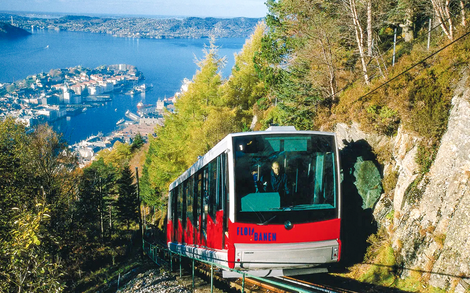 MT Floyen funicular ascending with Bergen cityscape and fjord in background, Norway.