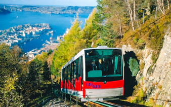 MT Floyen funicular ascending with Bergen cityscape and fjord in background, Norway.