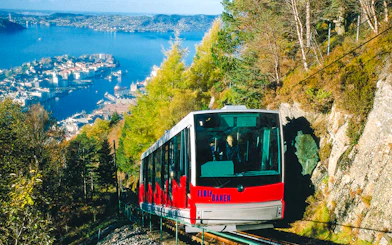 MT Floyen funicular ascending with Bergen cityscape and fjord in background, Norway.