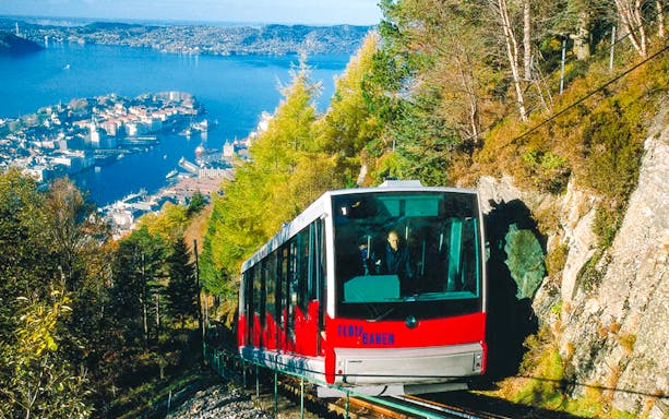 MT Floyen funicular ascending with Bergen cityscape and fjord in background, Norway.
