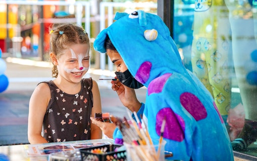 Child getting face painted at Rawai Kids Park.