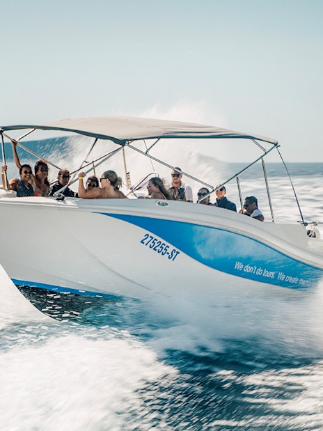 Guests speedboating in Blue Lagoon, enjoying the ride on a sunny day.