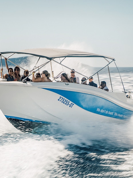 Guests speedboating in Blue Lagoon, enjoying the ride on a sunny day.